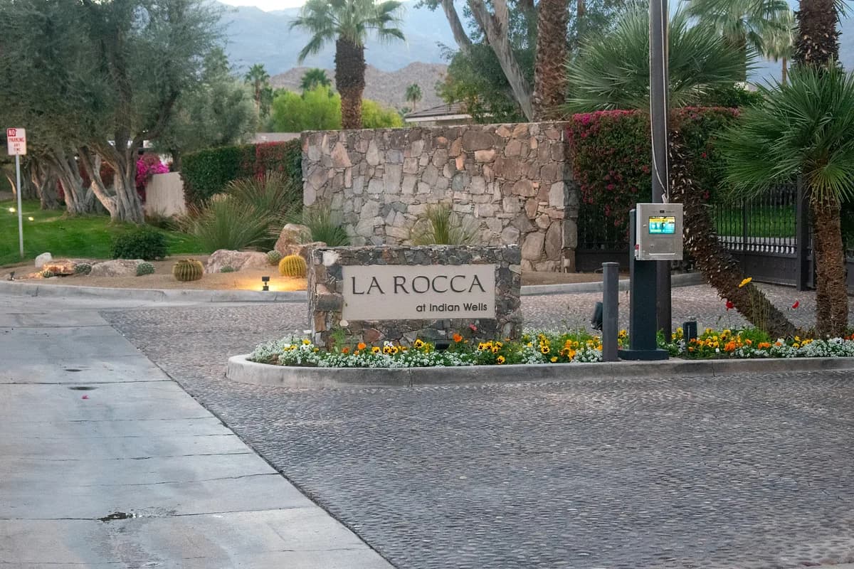 La Rocca entrance sign with seasonal flowers