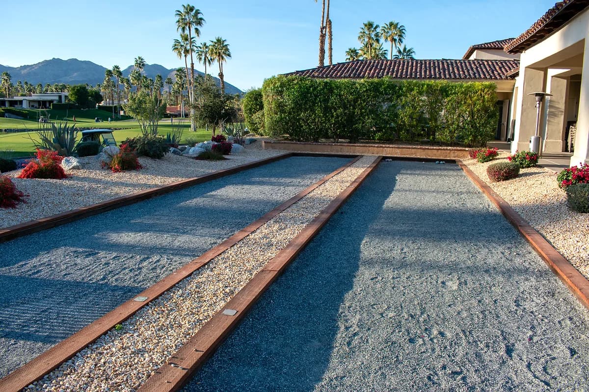 Bocce courts with palms and golf course